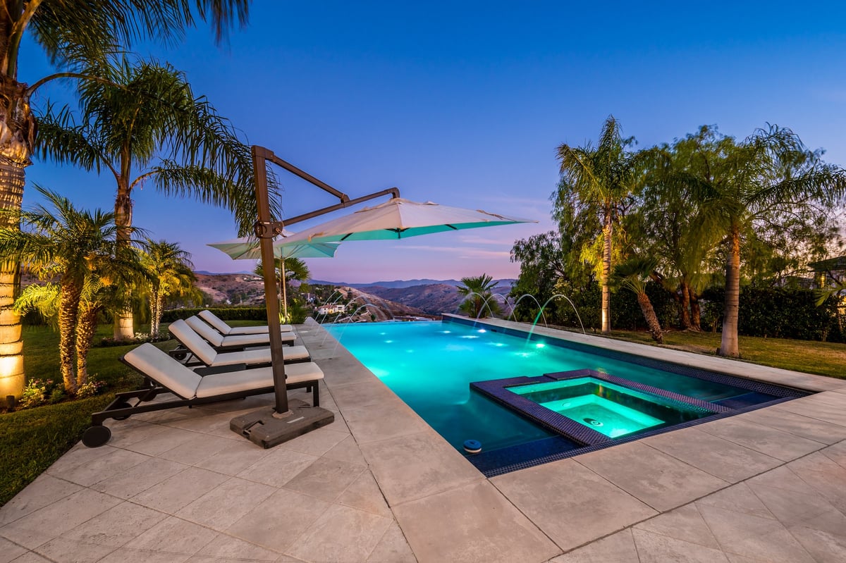 Luxury poolside with pristine lounge chairs